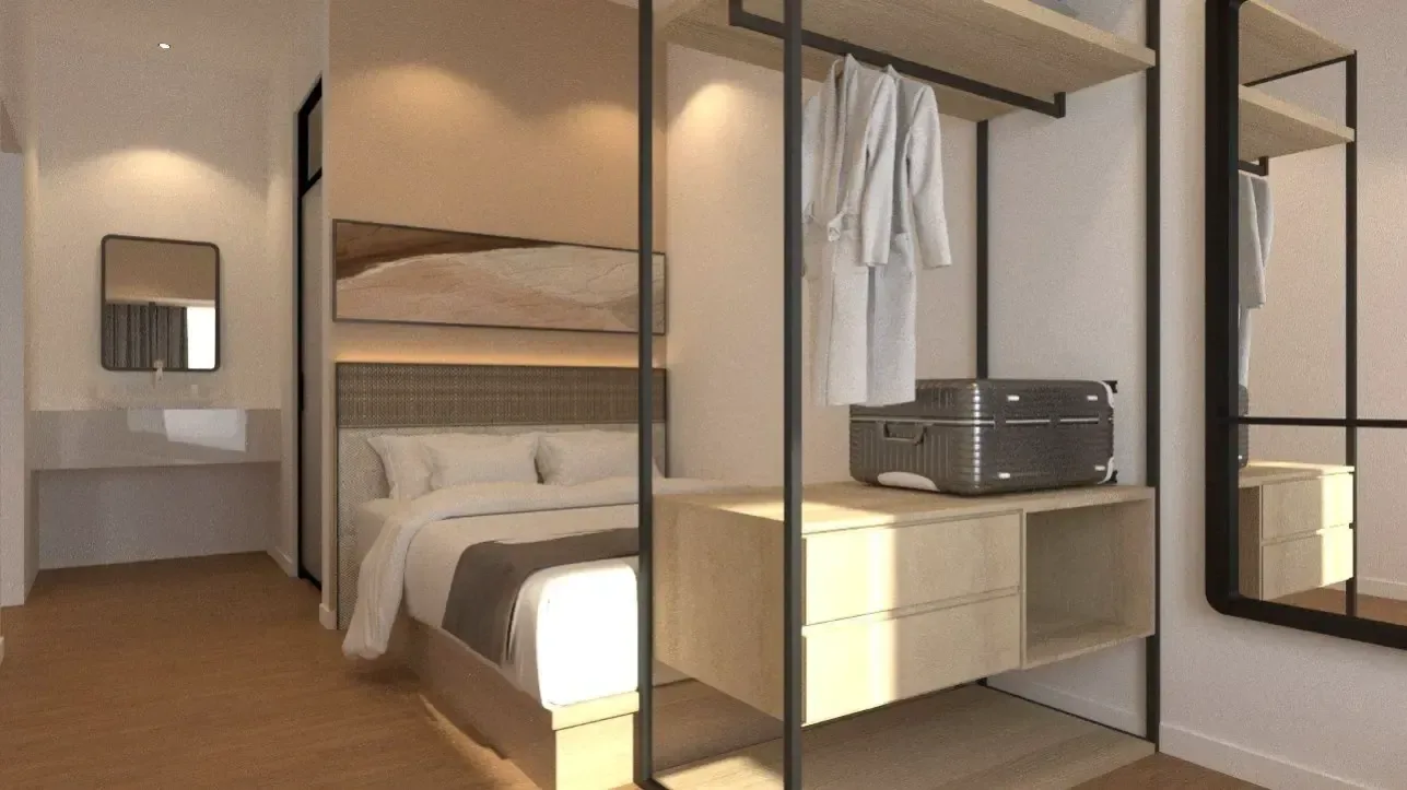 Furnished suite with open wardrobe and bedding at The Bedrock